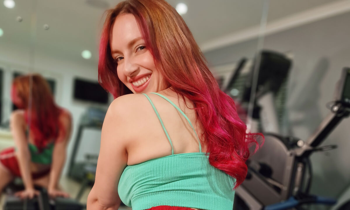 Busty Redhead Gym scene